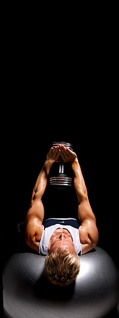 A fit guy training with weights image Leamington Spa